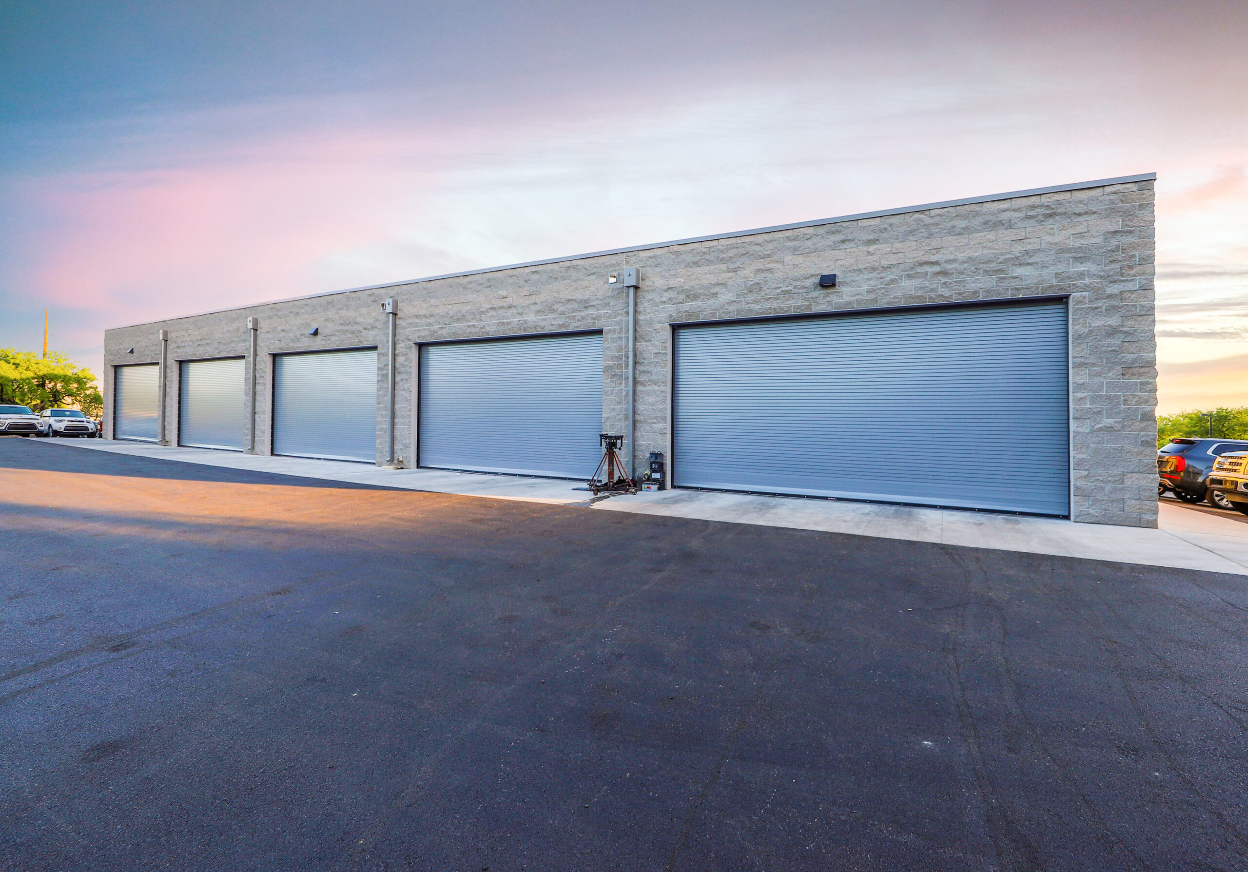 Exterior shot of four garage door bays