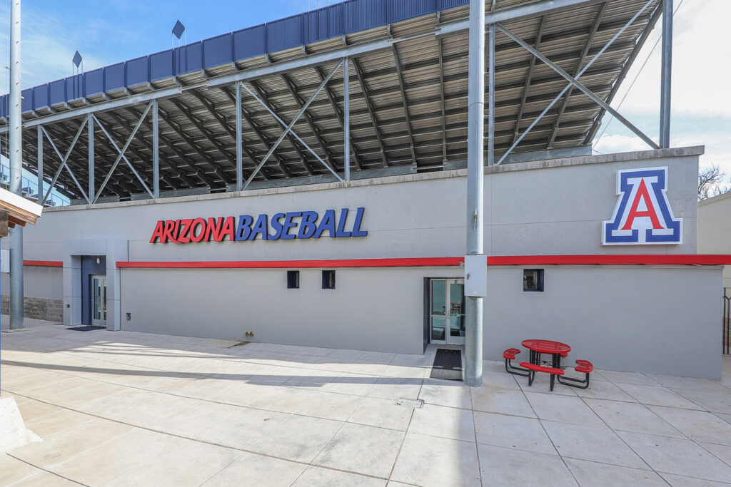 exterior of the hi corbett baseball stadium with the stadium signage and a view of the bleachers