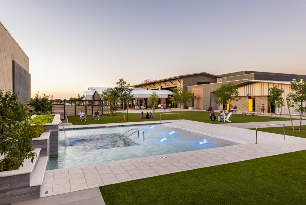 Outdoor baptism pool surrounded by grass