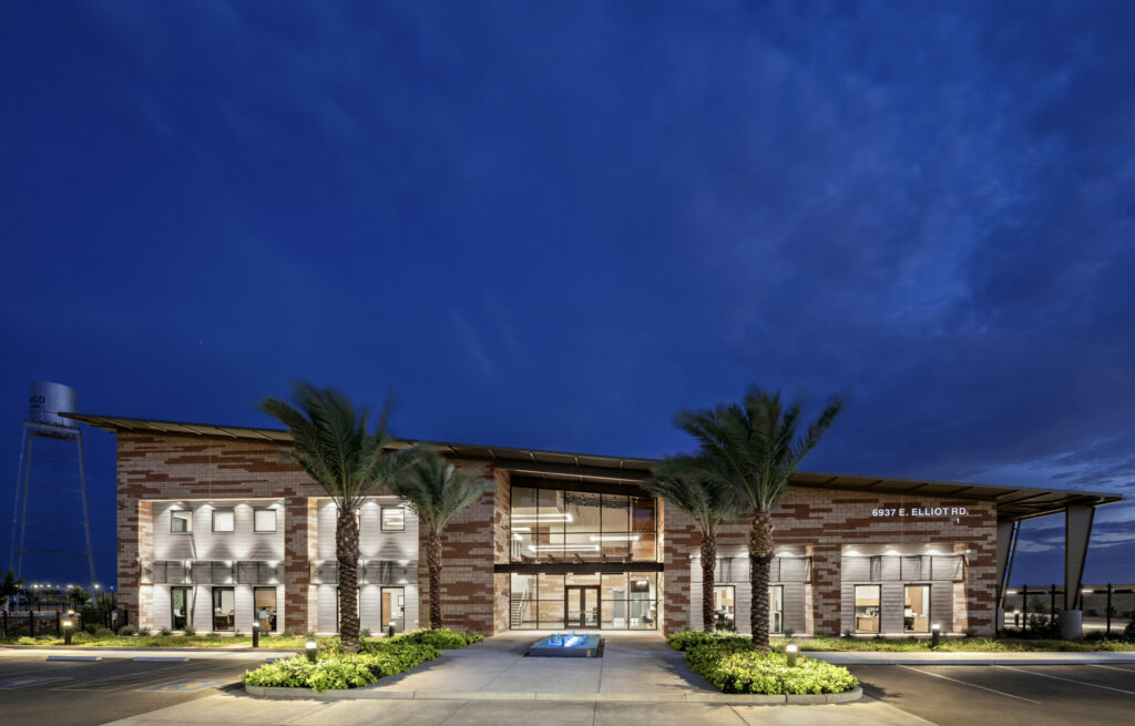 Night time photo of the front exterior of the building
