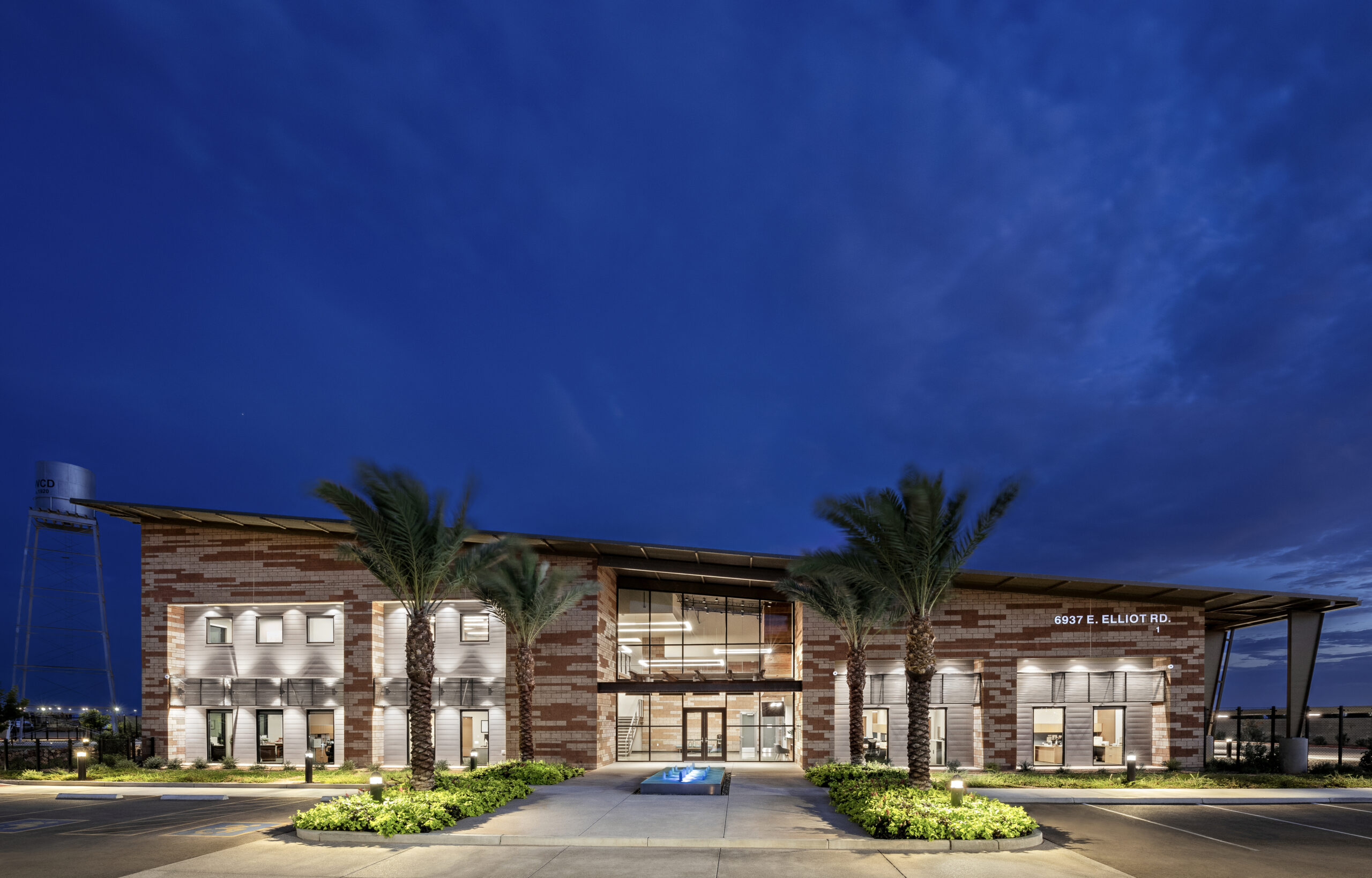 Night time photo of the front exterior of the building